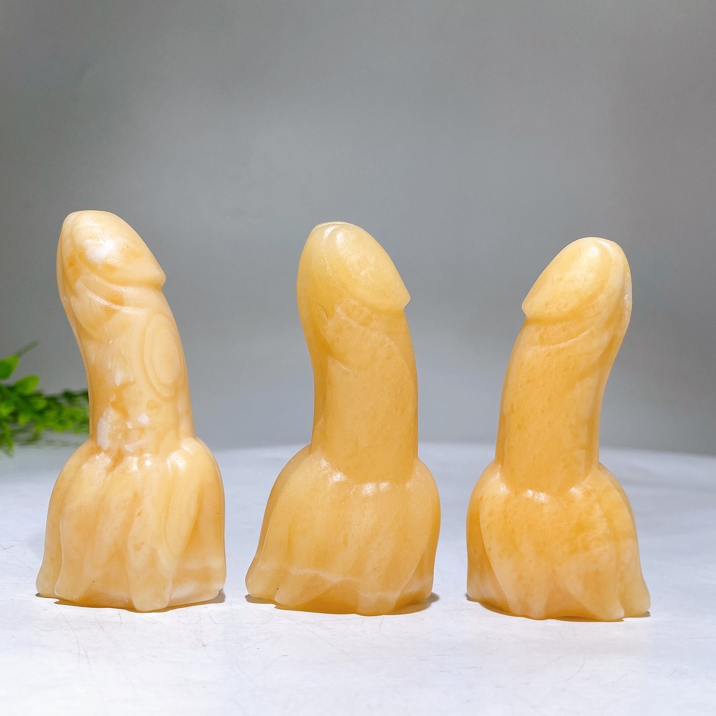 3.0" Orange Calcite Banana Ding Ding Carving Wholesale