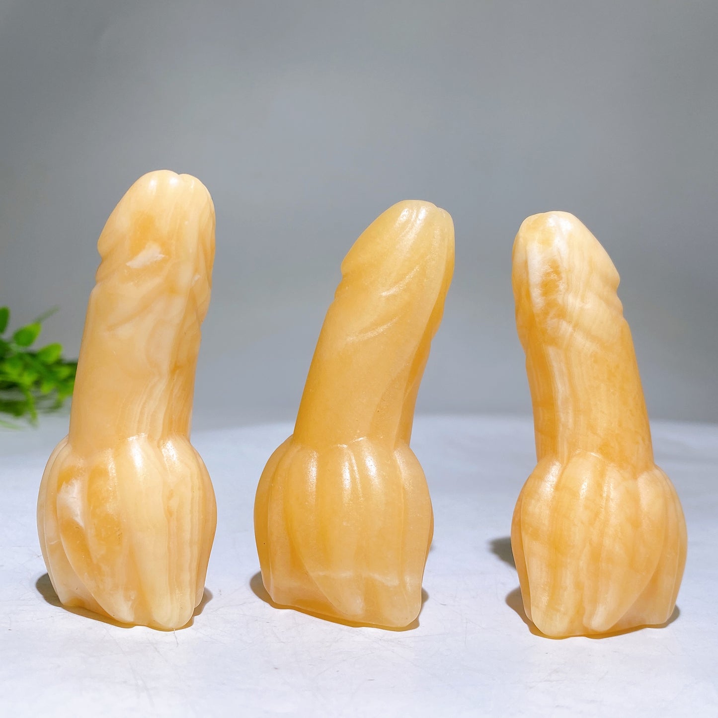 3.0" Orange Calcite Banana Ding Ding Carving Wholesale