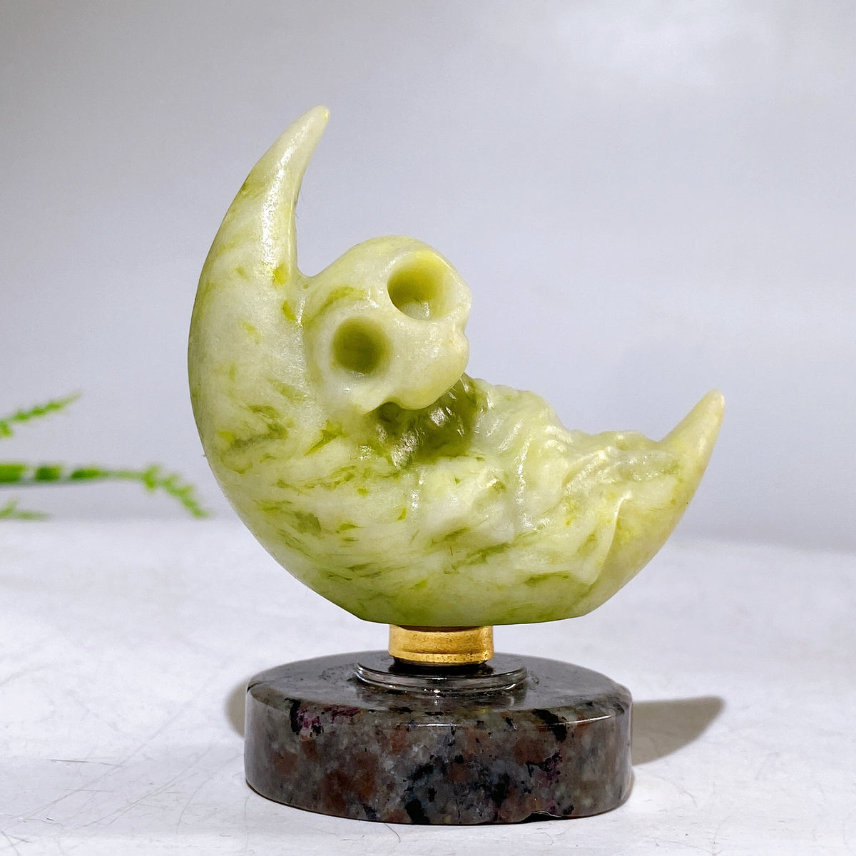 2.2" Natural Crystal Spinning Skeleton on Moon Carving with Yooperlite Base Carving Wholesale